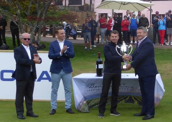 Billy Hemstock receives trophy from Nokia CEO Cormac Whelan flanked by club captain Roger Bridge and Mannings Heath Operations Director Adam Streeter