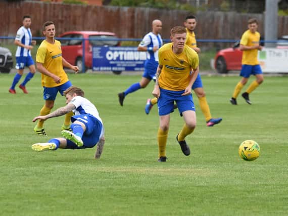 Liam Hendy comes away with the ball in Lancing's FA Cup clash at Haywards Heath Town. Picture by Hans Lehkyj