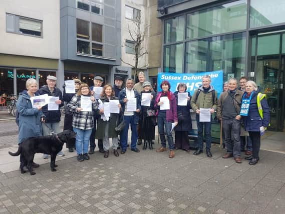 Campaigners outside Jubilee Library in March, before handing a petition to Brighton and Hove CCG