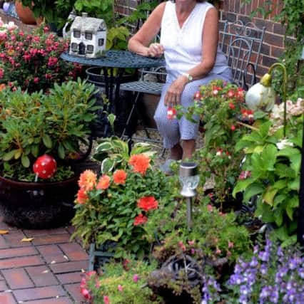 Linda Younger in her garden at Dingemans Court. Picture: Kate Shemilt ks180389-5
