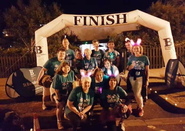 The team of staff, family and friends from A.R. Brown & Co Solicitors at the end of the Night to Remember for St Barnabas House