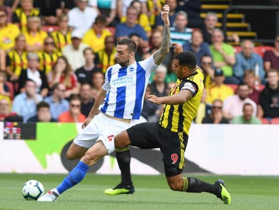 Albion defender Shane Duffy clears under pressure from Watford striker Troy Deeney on Saturday. Picture by PW Sporting Photography