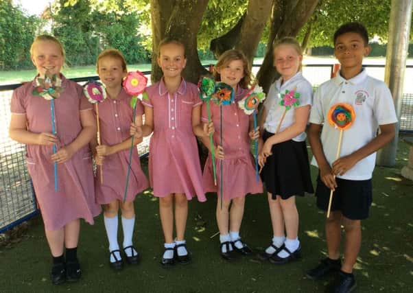 Georgian Gardens Community Primary School pupils with the flowers they made for the summer display