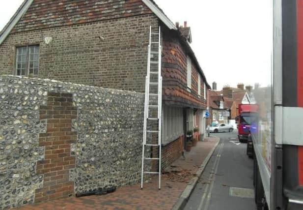 Damage to tiling and a drainpipe ... the scene in Lewes this morning