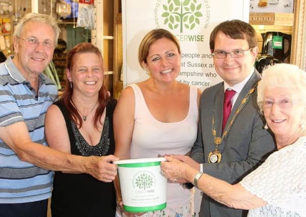 Raffle draw for Cancerwise with Cancerwise Rocks campaign at Owen Electricals. (From left) Michael Broomfield (owner), Jasia Denton (sales assistant), Emma Neno (Cancerwise fundraiser) Jamie Bennett, (chairman Rustington parish council) and Christine Greenfield (owner). Photo by Derek Martin Photograph