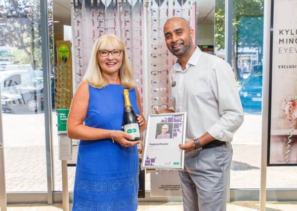 Julie Dillamore with Rishi Patel, store director of Specsavers Rustington