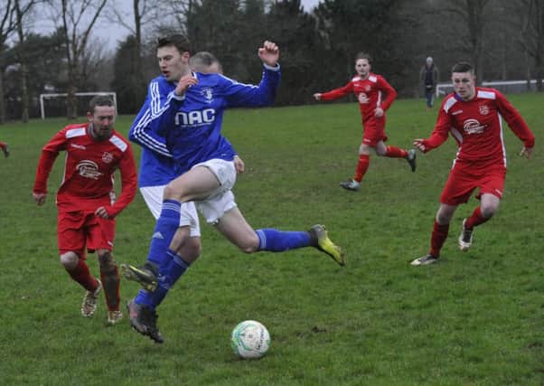 Ore Athletic (all red kit) in action against St Leonards Social last season. Picture by Simon Newstead