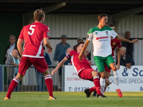 Jimmy Muitt tries to get Bognor on the attack against Merstham / Picture by Tommy McMillan
