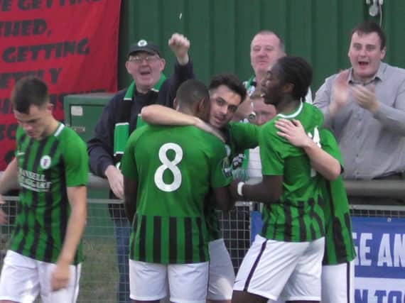 Burgess Hill Town players celebrate Conbnor Tighe's goal against Harlow Town. Picture by Peter Chapman