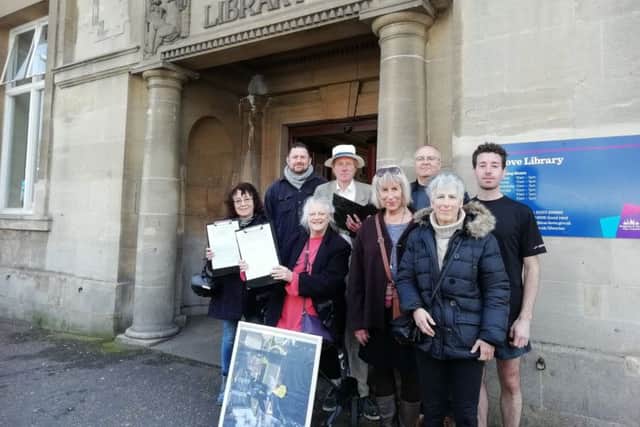 Conservative and Green councillors join campaigners outside Hove Library