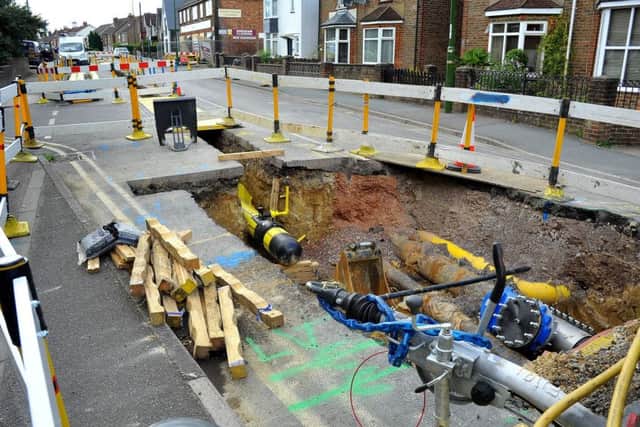 Crawley Road has been closed for 14 weeks for road works and Brad Patel and Mina of Chirag News are upset at losing trade. Pic Steve Robards SR1821071 SUS-180814-210118001