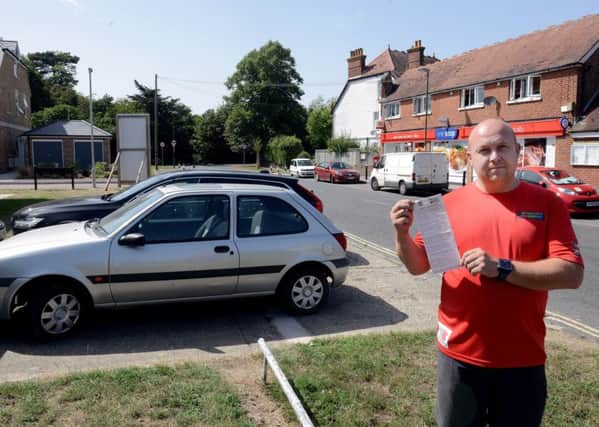 ks180378-3 Chichester Drive Ticket  phot kate Peter Dallaway with the parking ticket he received for having a car parked on the driveway to his house.ks180378-3 SUS-180608-182338008