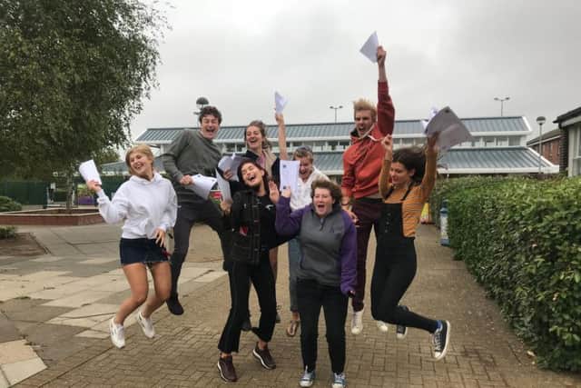 Students jump in joy after receiving impressive exam results
