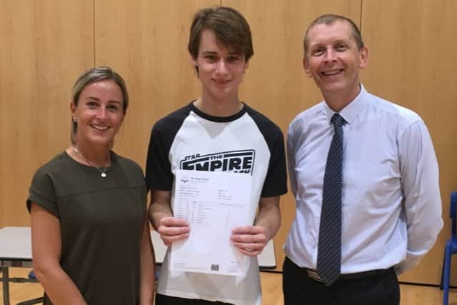 Budding astrophysicist George Hume with head of sixth form Connie James and principal Mike Garlick