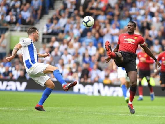 Pascal Gross and Paul Pogba battle for the ball. Picture by PW Sporting Photography