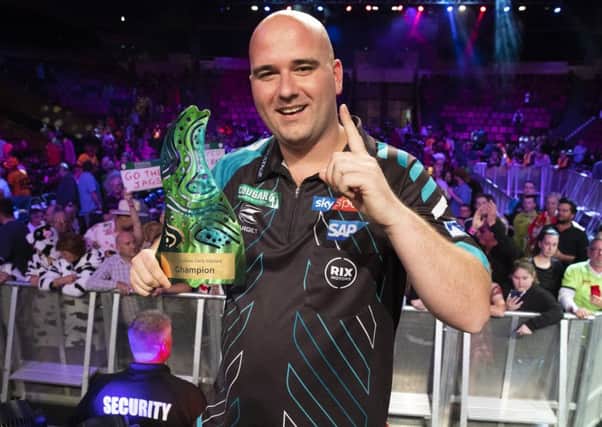 Rob Cross clutches the Brisbane Darts Masters trophy. Picture courtesy PDC/Richard Walker