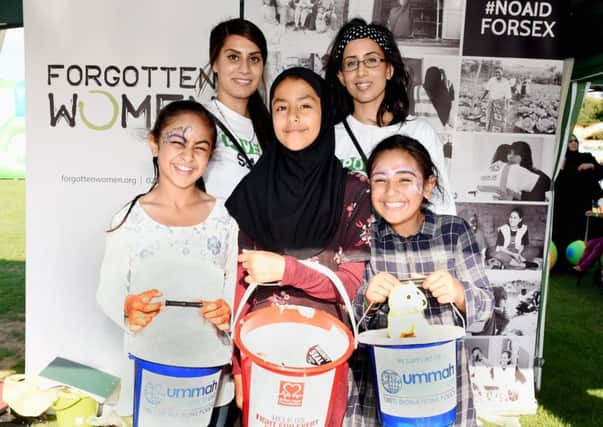 Volunteers helping to raise money at the event for Forgotten Women, Ummah and The British Heart Foundation.   L-R ( back) Mandeep Kaur (volunteer for Forgotten Women), Gee Kaur (Volunteer for Forgotten Women) and front L-R Aleena Ulhaq (9),  Juwayriyh Mahmood (12) and Naima Ulhad (8). Picture: Liz Pearce:  LP181228
