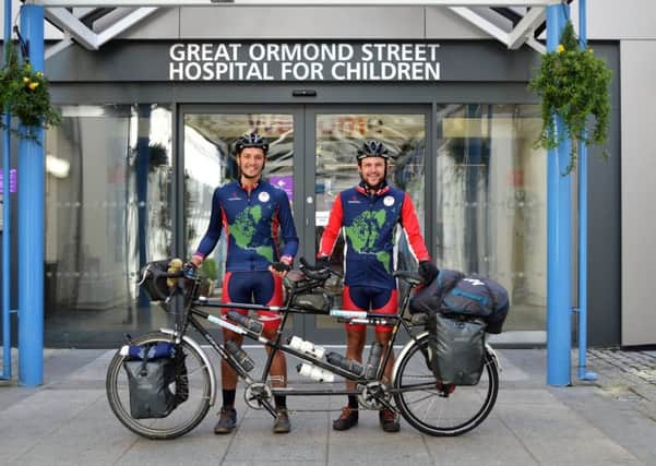 George Agate from Amberley and his friend John Whybrow have been awarded a Guinness World Record as the fastest male pair to travel the world by tandem bicycle SUS-180822-090353001
