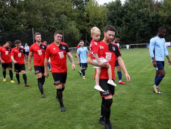 AFC Uckfield players walk out to face Glebe in the previous round. Picture by Ron Hill