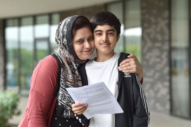 Shahzaib Ali with his GCSE results at BACA, with his mother Shumaila

  (Photograph: Simon Dack/Vervate)