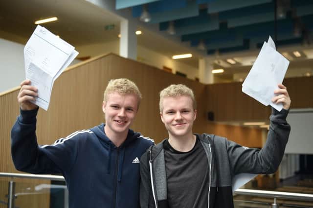 Twins Leo and Jamie Upton-Maher celebrate their GCSE results

 at BACA  (


Photograph: Simon Dack/Vervate)