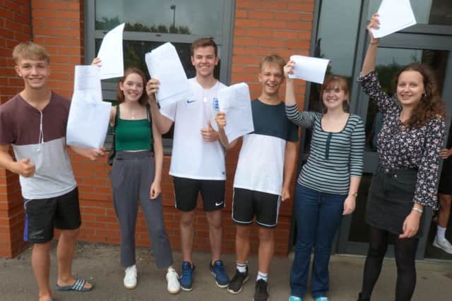 Pupils celebrate their GCSE results at The Weald