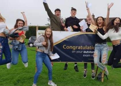 Students at Warden Park Secondary Academy celebrating their GCSE results
