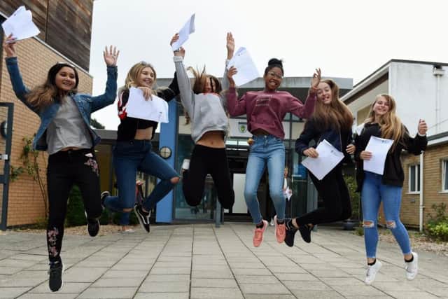 Students at Burgess Hill Academy jumping for joy after receiving their GCSE results today. Picture: Liz Pearce