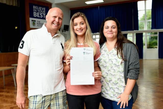 High achiever Lauren Wickens with assistant principal Adam Smith (left) and Caroline Gaiger, head of Year 11. Picture: Liz Pearce