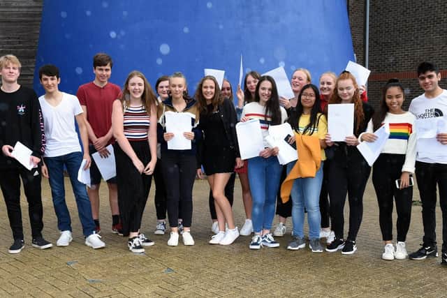 Students at St Paul's Catholic College in Burgess Hill celebrating their GCSE results. Picture: Liz Pearce