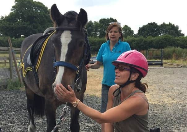 South Downs RDA rider Amanda Worne from Yapton getting to know her new pony, Beau
