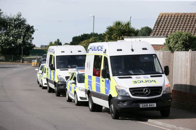 A large police presence in West End Way, Sompting SUS-180824-120050001