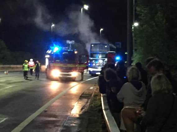 A bus full of festivalgoers burst into flames on the M275 last night. Picture: Mark Waldron