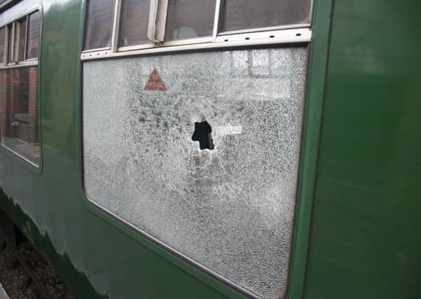 Two youths were reportedly throwing stones at the moving train. Pictures: Eddie Mitchell