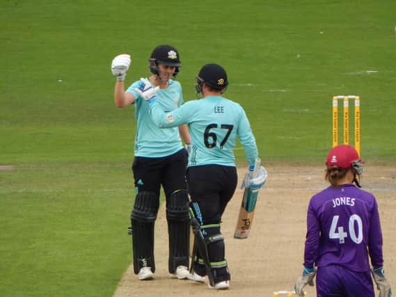 Lizelle Lee celebrates her ton with Nat Sciver