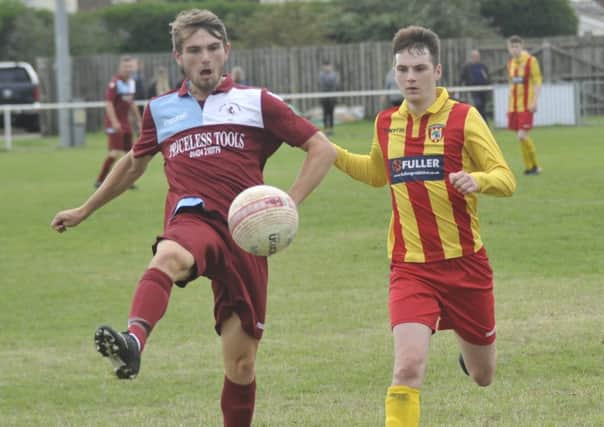 Little Common midfielder Kane Penn helps the ball forward against Lingfield. Pictures by Simon Newstead