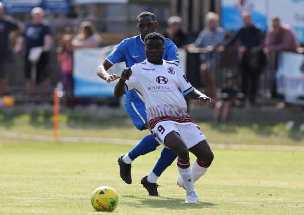 Daniel Ajakaiye holds off an opposing defender during Hastings United's 3-2 FA Cup victory at home to VCD Athletic on Saturday. Picture courtesy Scott White