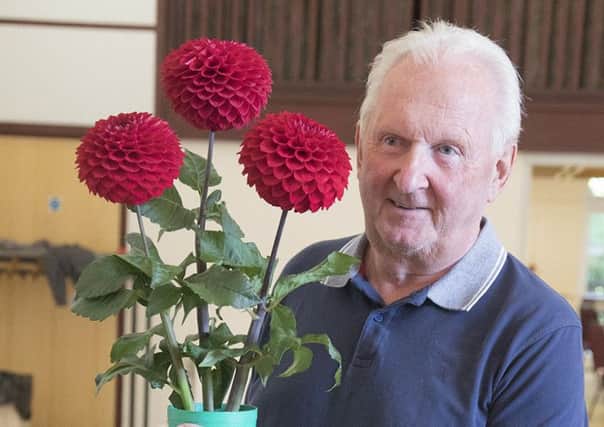 John Cole with his winning vase of dahlias