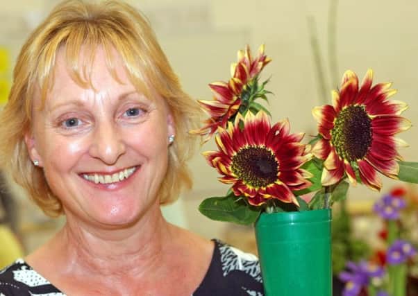 Sarah Scrace won first prize for her sunflowers. Picture: Derek Martin DM1890574a