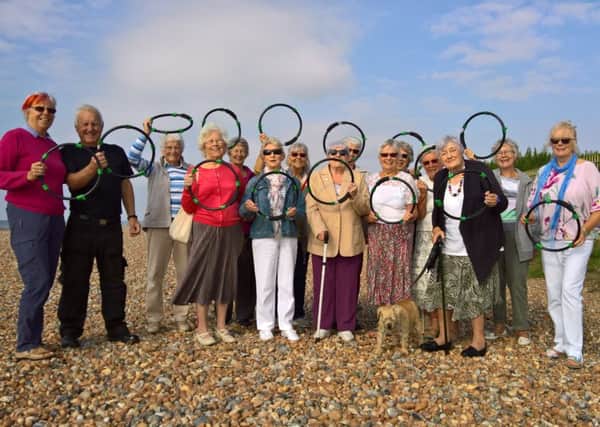 Members of St Mary the Virgin Womens Fellowship present 20 new litterbag hoops to East Preston Parish Council