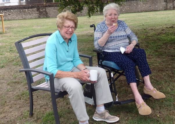 Resident Annette with her sister Jill in the garden at Cavell House in Shoreham