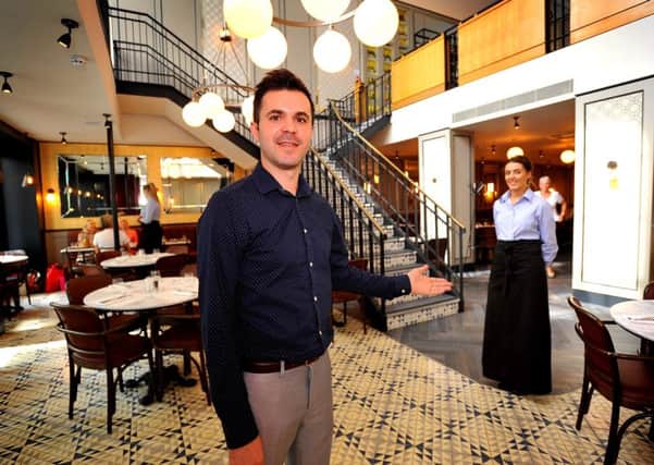 Manager Pedro Martins welcoming diners into the reopened Cote Brasserie. Pic Steve Robards SR822800