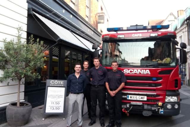 Cote manager Pedro Martins with Richard Randall, Robert Hollingum and Matt Cole from C Watch at Horsham Fire Station