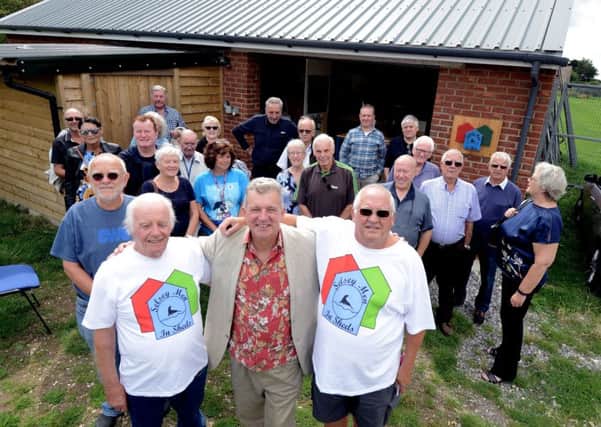 ks180425-1. Actor Tim Rose, centre front officially opened the Men in Sheds building in Selsey, here with friends and supporters of the venture. Photo: Kate Shemilt