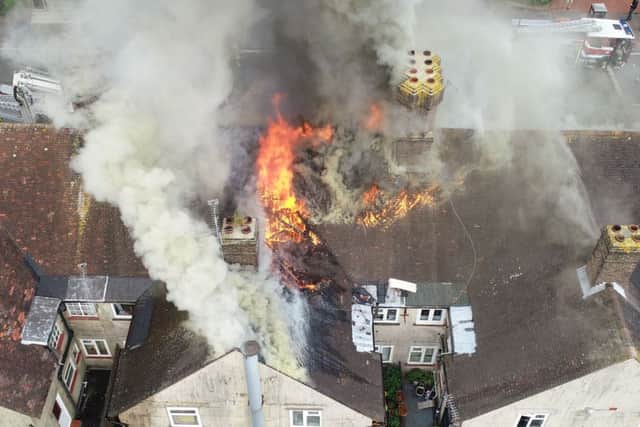 Aerial images showed the flames through the roof