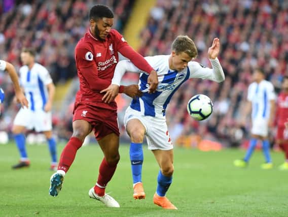 Solly March battles for possession with Liverpool's Joe Gomez at Anfield last weekend. Picture by PW Sporting Photography