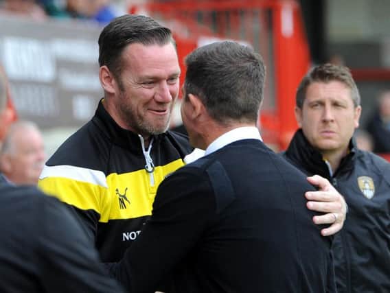 Crawley Town boss Harry Kewell and then Notts County manager Kevin Nolan embrace on the touchline last season. Picture by Steve Robards. SR1723053