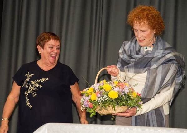 Judy Parfitt recieving flowers for opening the anniversary party SUS-180309-084836001