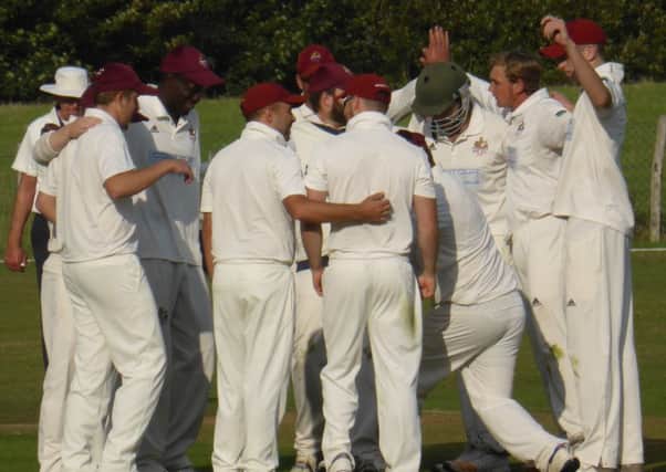 Rye celebrate a wicket during their victory away to Crowhurst Park. Pictures by Simon Newstead