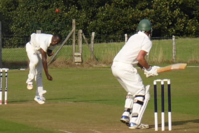 Rye's overseas player Cleon Reece bowling to Crowhurst Park all-rounder Paul Brookes.
